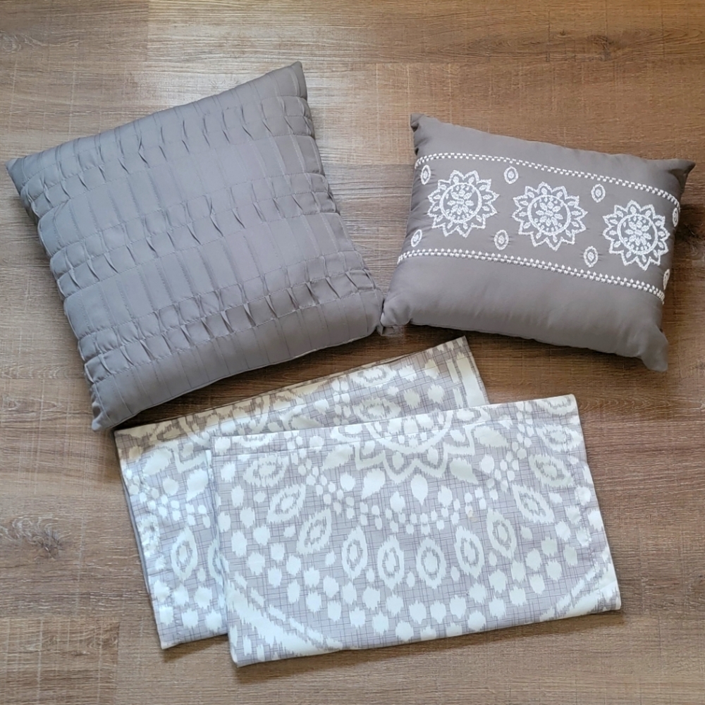 Two decorative pillows and two king size pillow shams.